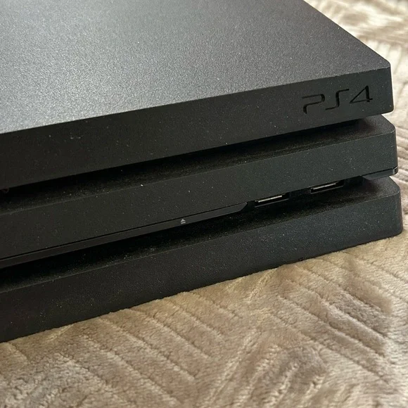 PS4 Pro + Controller + Power Cord + HDMI Cord + 2 Games